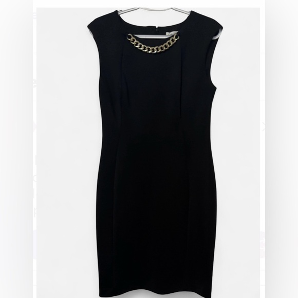 CALVIN KLEIN
Pre-loved Black Dress with Chain Accent
Size: 8 - Picture 1 of 4